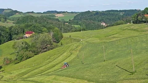 Tractor Working in Green Fields of Rural Austria at Sunset Vídeos de archivo 339177714