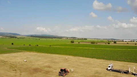 Tractor working with Hay Bale. Stock Footage 91444351