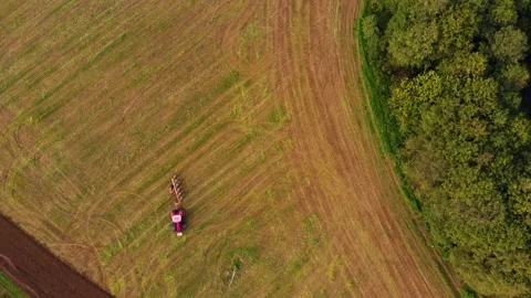Tractor working one farm field drone view Stock Footage 141818736