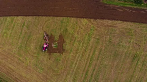 Tractor working one farm field drone view Stock Footage 141819108