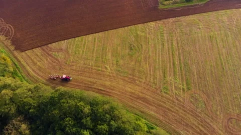 Tractor working one farm field drone view Stock Footage 141819267