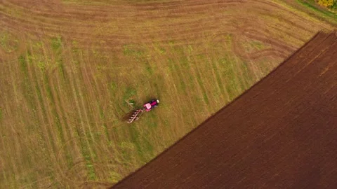 Tractor working one farm field drone view Stock Footage 141819982
