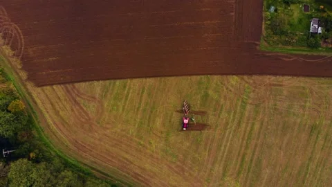 Tractor working one farm field drone view Stock Footage 141820497
