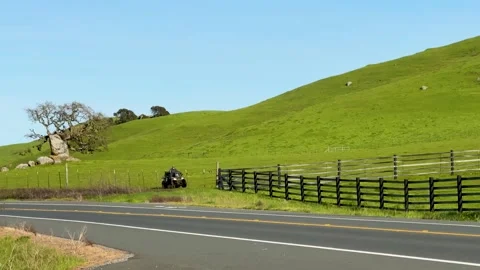Tractor Working in Open Green Field Stock Footage 307963268