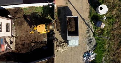 Tractor works on the construction of a cottage Stock Footage 144450118