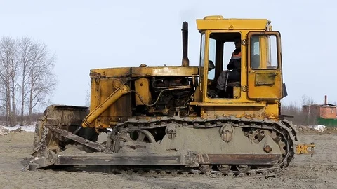 Tractor works on the construction site in the cold winter Stock Footage 104962568