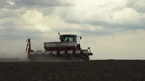 Tractor works in the field. sowing corn. precision farming. close-up. Stock Footage 202286478