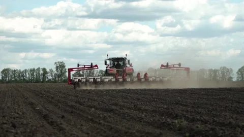 Tractor works in the field. sowing corn. precision farming. Stock Footage 202286736