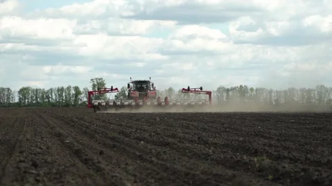 Tractor works in the field. sowing corn. precision farming. Stock Footage 202286973