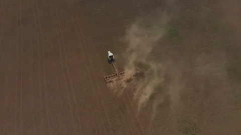 Tractor works with a plow on the field Stock Footage 89707404