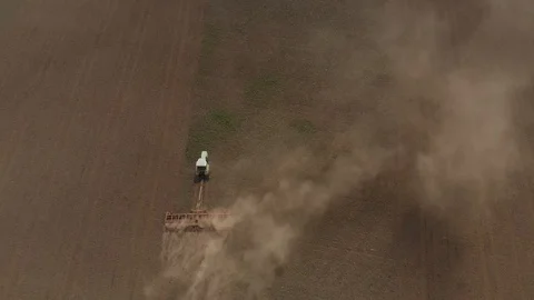 Tractor works with a plow on the field Stock Footage 89707417