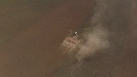 Tractor works with a plow on the field Stock Footage 89707422