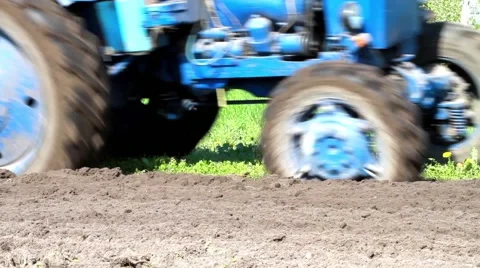 Tractor works in a rural field Stock Footage 52291488