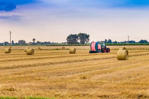 Tractorpress hay bales Stock Photos
