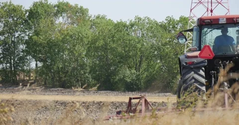 Tractor's Backside Tractor is Plowing The Field Driver's Silhouette Sign on the Stock Footage 53618900