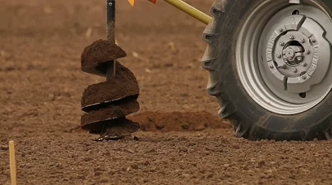 Tractors digging holes for fruit trees in the farm, rural landscape Stock Footage 62260595