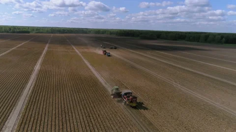 Tractors drive on a field 库存影片 93139772