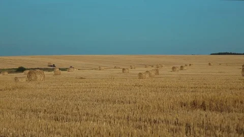Tractors in the field with haystacks Stock Footage 81856277