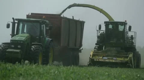 Tractors harvest hay for livestock 6 Stock Footage