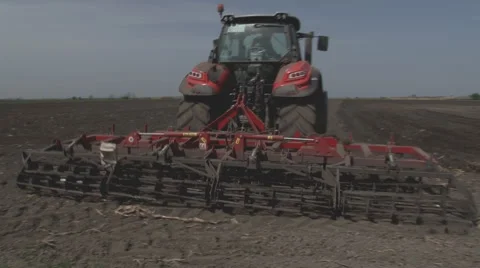 Tractors preparing land for sowing Stock Footage 64052504