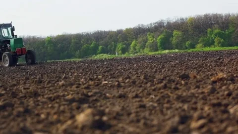 Tractors preparing land for sowing Stock Footage 75174863