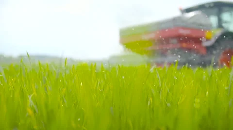 Tractors sprayed with fertilizer Stock Footage 64026928