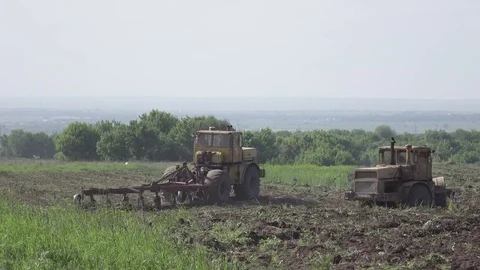 Tractors turn in the field. 4k. Flat pikture profile Stock Footage 75817817