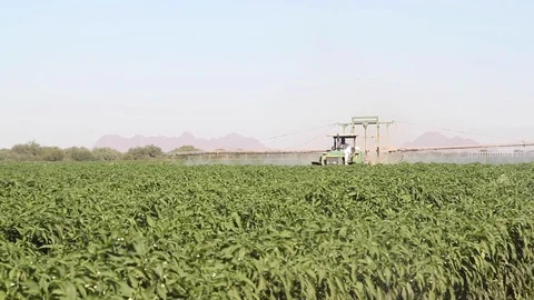 Tractors watering a plot - 02 Stock Footage 130041932