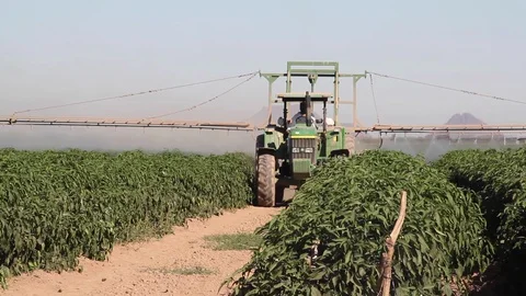 Tractors watering a plot Stock-Footage 130041799