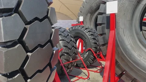 Trade Fair for Coal Mining Technology. Giant car tires Belshina. Stock Footage 155802794