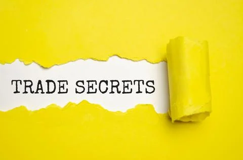 Trade Secrets written behind torn paper. concept Stock Photos