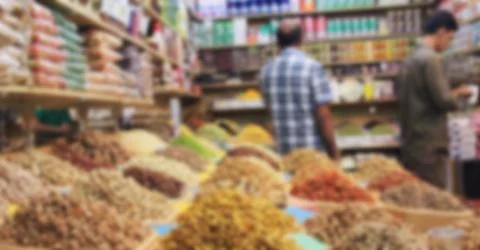 Trade in spices and nuts on the counter, dried food baskets on the market Stock Photos
