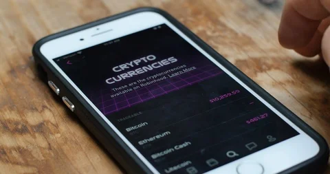 Trader Checking Cryptocurrency Pricing on App Vidéo 126359610
