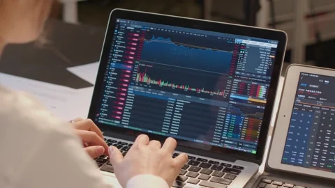 Trader Checking Stock Market Data on Laptop and Smartphone Video stock 336551127