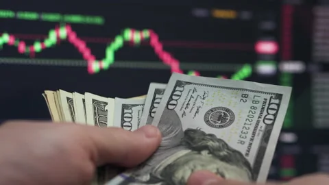 Trader Counting Dollars Watching Chart Stock Footage 198734345