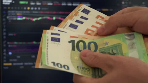 Trader Counting Euros Chart on Background Stock Footage 229909852