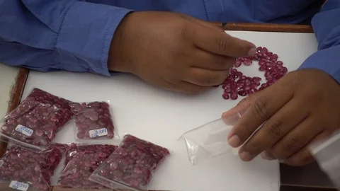 A trader displays gemstone or crystal in the trading market THAILAND. Stock-Footage 95768005