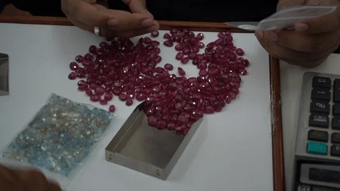 A trader displays gemstone or crystal in the trading market THAILAND. Stock-Footage 95770021