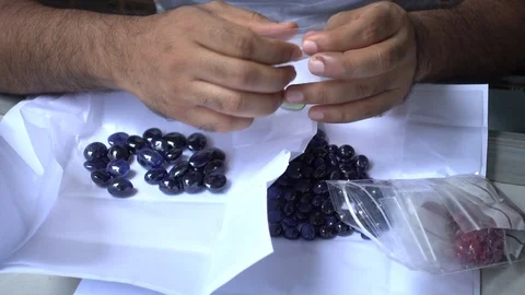 A trader displays gemstone or crystal in the trading market THAILAND. Stock-Footage 95770113