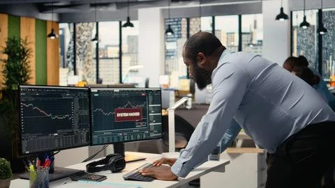 Trader frightened by security alert on PC after hacker uses exploits Stock Photos