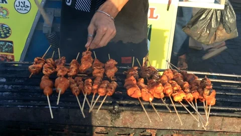 A trader is grilling meatballs Stock Footage 280893863