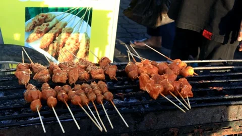 A trader is grilling meatballs Stock Footage 280893921
