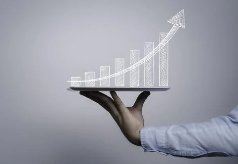 Trader holding computer tablet with hand writing of chart and graph Stock Photos