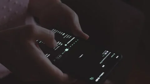 Trader investor analyst using mobile phone app. Analytics for financial stock Stock Footage 250360522