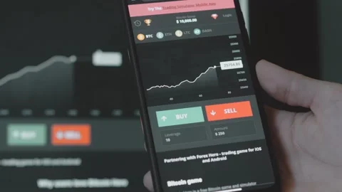 Trader investor analyst using mobile phone app and computer. Analytics for Stock Footage 250362632