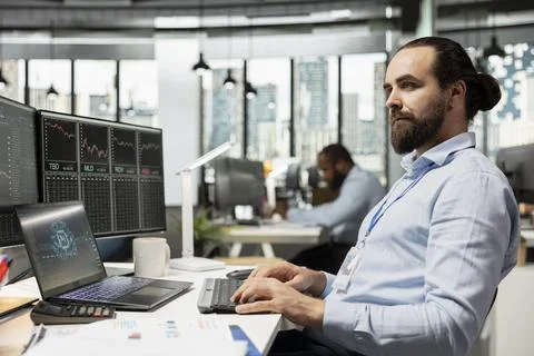 Trader leverage AI model program on laptop to optimize trading strategies. 스톡 사진