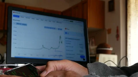 Trader Is Looking At Financial Charts On The Computer Monitor. Bitcoin, Crypt Vídeos de archivo 159790736