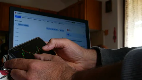 Trader Is Looking At Financial Charts On The Computer Monitor. Bitcoin, Crypt Vídeos de archivo 159791041