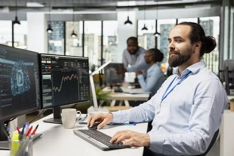 Trader in office using machine learning models to enhance predictive accuracy Stock Photos