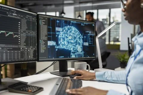 Trader in office utilizing AI LLM chatbot for instant market analysis 库存照片